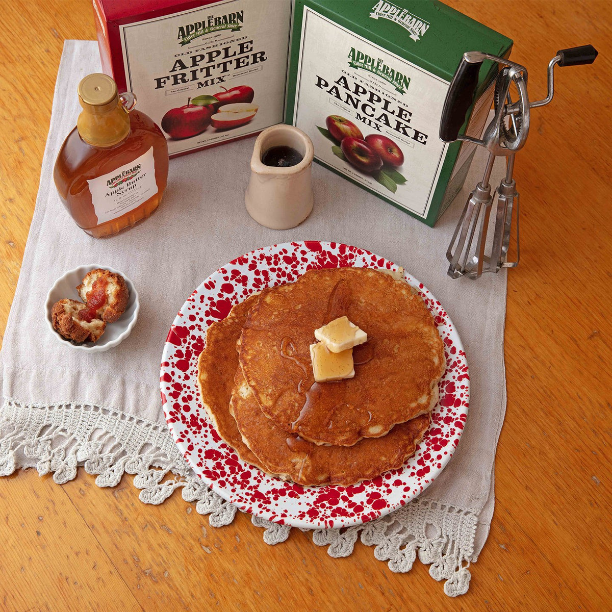Apple butter syrup on apple pancakes and apple fritters
