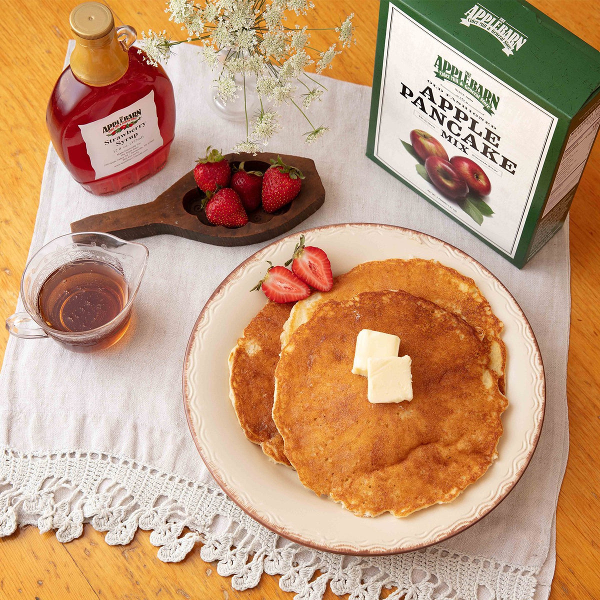 Strawberry syrup on apple pancakes